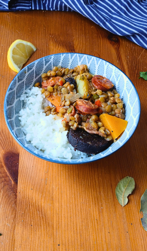 brown lentil soup served on a bowl with rice