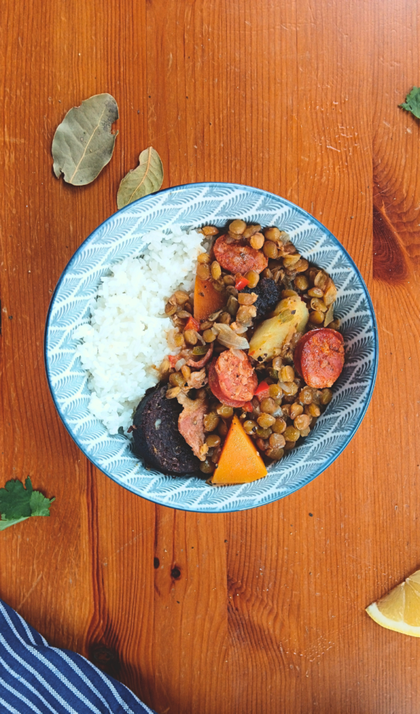 brown lentil soup served on a bowl with rice